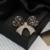 Moda europeia e americana novo broche de borboleta com diamantes de alta qualidade temperamento feminino alfinete requintado corsage da moda joia de cristal