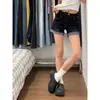 Shorts de mezclilla sexy retro americano para mujer, 2026 verano pantalones cortos ajustados elásticos de cintura baja para cuerpo con forma de pera con bordes doblados