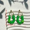 Calle popular transfronteriza. Pendientes verdes del Día de San Patricio, diseño de nicho, pendientes de temperamento de mujer de alta calidad, venta al por mayor