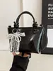 Bolsa Tendência 2025 Nova Bolsa de Ombro Feminina Tendência Transfronteiriça Nicho Versátil Bolsa Transversal para Mulheres