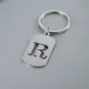 Venta Caliente de Productos Nuevos Transfronterizos 26 Letras Inglesas Huecas de Acero de Titanio Sin Decoloración Accesorios de Joyería Llavero 26 Letras