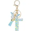 Llavero de Resina de Venta Caliente Transfronterizo 26 Letras Llavero de Moda Colgante de Mariposa Llavero de 26 Letras Mayoreo