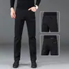 Jeans negros puros para hombre, marca de alta gama de moda, estilo otoño e invierno, corte slim recto, elásticos, estilo coreano, pantalones de vestir modernos para hombre