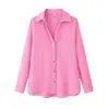 Ropa de mujer transfronteriza al por mayor 2026 nueva moda casual versátil color liso con botones manga larga cuello camisero top