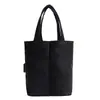 Bolsa para Garrafa de Água com Bloqueio de Cor Simples Bolsa de Mão Feminina 2026 Outono Nova Bolsa de Lona Nicho Ombro Único Bolsa Tote para o Dia a Dia