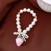 Pulsera de Fresa con Lazo de Perla y Circonita Transfronteriza, Pulsera Única de Nicho de Lujo Ligero, Joyería de Mano Simple, Moderna y Versátil para Mujeres