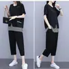 Nuevo traje de verano para mujer talla grande Adelgazante Holgado Moda Elegante Rayas Camiseta de manga corta Pantalones de nueve cuartos Conjunto de dos piezas