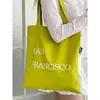 Bolsa de Lona com Estampa de Letras Nova Primavera Grande Capacidade Bolsa de Ombro Feminina Simples Fresca Versátil