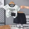 Kids2026 Nuevo Conjunto de Dos Piezas de Manga Corta de Verano Atuendo de Verano para Niños Delgado Tie-Dye Rayas Anchas Bolsillo Conjunto para Niños Moderno