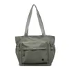 Bolsa de Lona de Grande Capacidade para Mulheres 2025 Novo Estilo Bolsa Tote para Trabalho e Deslocamento Bolsa de Mão Casual para Estudantes Bolsa de Ombro