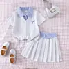 Sudadera de dos piezas falsa de punto transfronteriza, bloques de color, manga corta, verano, nueva, cuello vuelto, holgada, versátil, conjunto de ropa para niños, en stock
