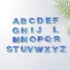 Colgante de doble hechizo con gradiente de piedra de lentejuelas azules transfronterizo, 26 letras inglesas, llavero de pegamento, joyería, letra, venta al por mayor
