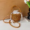 Bolsa de Balde Artesanal Tecida com Contas de Madeira de Design de Nicho de Verão Transfronteiriça para Mulheres 2026 Nova Bolsa Tote Grande Exquisita