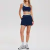 Nuevo traje deportivo de dos piezas de color contrastante transfronterizo para mujer, adecuado para correr, fitness, yoga y tenis, con un top sin mangas y una minifalda.
