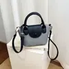 Bolso de mano de nicho retro color block, nuevo estilo para mujer 2026, adecuado para el trabajo y los desplazamientos, mini bolso de hombro versátil