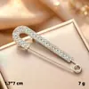 Broche transfronterizo, alfiler de perla, faja para la cintura, broche anti-exposición, accesorio de ropa, pin para afinar la cintura y pin de ajuste de cintura para pantalones