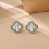Pendientes de botón de trébol de cuatro hojas con circonita de venta caliente, frescos, dulces, a la moda, con sensación de alta gama, pendientes para mujer, estilo pequeño Chanel, joyería exquisita
