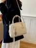 Bolso de mano casual y moderno, bolso para el trabajo, bolso tipo almohada, nuevo y moderno bolso de hombro de color liso, estilo retro versátil, el bolso popular para mujer de este año