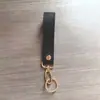 Llavero de Cuero PU Simple y de Alta Gama Colgante de Bolsa Regalo Coche En Stock Venta al por Mayor Exquisito