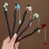 Nuevo Estilo Chino Elegante Tassel de Lirio del Valle Pasador de Pelo Estilo Antiguo Dinastía Han Pasador para Cheongsam Pasador de Madera Imitación Ébano Elegante Adorno para el Cabello para Mujeres