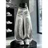 Jeans de diseño estilo americano con estampado de tinta para hombre y mujer, pantalones de otoño con lavado tie-dye degradado, pantalones vintage de corte holgado hasta el suelo