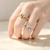 Anillo nuevo transfronterizo, anillo de rombo moderno incrustado con diamantes de acero inoxidable, diseño de alta gama y elegante, joya de mano de acero de titanio