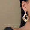 Brincos de Zircônia Vazados em Forma de Gota d'Água para Mulheres Estilo Novo Luxo Leve Sensação de Alto Padrão Design de Nicho Tarraxas Retrô Acessórios de Brincos Exagerados Personalizados