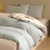 Juego de cuatro piezas de algodón puro cepillado de lujo ligero para otoño e invierno, juego de ropa de cama de tres piezas de color liso bicolor de algodón cálido y grueso