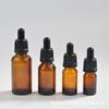 Sub-botella gotero de vidrio ámbar botella de aceite esencial a prueba de luz 5ml-10ml botella de líquido de esencia despliegue con cabeza de goma pequeña botella vacía