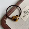 Novo Acetato Etiqueta Dourada Coração Faixa de Cabelo Primavera e Verão High-End Coreano França Feminino Rabo de Cavalo Alto Elástico de Cabelo Tiara