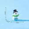 Decorações de Natal em miniatura: uma pequena figura de boneco de neve segurando uma placa, perfeita para criar uma charmosa paisagem de inverno, decorações DIY e pequenos enfeites
