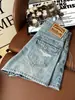Shorts Jeans Rasgado com Barra Desfiada Estilo Retrô Americano Feminino Emagrecedor Versátil Tendência Hot Girl 2026 Calças Estilosas Tendência