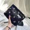 Nova Bolsa de Maquiagem Feminina Design de Nicho Original Bolsa de Mão Jacquard Elegante Artística Retrô Lisa Elegante Bolsa de Armazenamento Conveniente