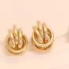 Pendientes Metálicos Vintage Transfronterizos Europeos y Americanos para Mujer, Estilo Punk, Geométrico Retorcido de Moda, Pendientes de Botón Modernos, Venta Directa del Fabricante