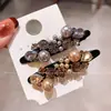Pinzas para el cabello de pico de pato de alta gama estilo coreano con incrustaciones de perlas y diamantes para mujer, con un diseño lujoso para flequillos laterales y peinados en la parte posterior de la cabeza, un nuevo accesorio para el cabello para mujer