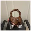 Bolso de Diseño de Nicho Moda Femenina Versátil Bolso de Hombro para Viajes Cotidianos Textura Retro Bolso Cruzado Casual Bolso Dumpling