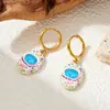 Aretes en forma de flor, diseño ovalado, con efecto de aceite goteando, acero inoxidable chapado en oro, dulces y versátiles, aretes de mujer modernos y a la moda, disponibles en Amazon