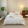 Conjunto de cuatro piezas de algodón Tianzhu de color sólido de estilo japonés, ropa de cama para dormir desnudo de otoño e invierno, sábana de algodón de punto, funda de edredón