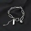 Novos acessórios de corrente de aço titânio etiqueta de bola pequena corrente de suéter de personalidade estilo frio INS celebridade da internet hip hop pingente produto de moda