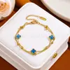 Estilo vacacional de playa europeo y americano trébol de cuatro hojas de la suerte titanio acero no se decolora diseño cadena floral pulsera de doble capa venta al por mayor