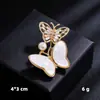 Broche hebilla de resorte anti-luz primavera y otoño pin fijo para suéter cárdigan broche mariposa perla venta al por mayor pin para pañuelo de seda para mujer
