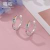 Pendientes Xi Gu E1074 S925 de plata con incrustaciones de circonitas y ondas de colores, sin orificios para las orejas.
