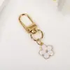 Llavero Dulce y Colorido de Flor de Cerezo Estilo Coreano Simple Ins Alto Valor Colgante Floral Fresco para Mochila
