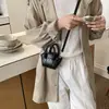 Mini Bolsa Balde Retro Portátil para Mulheres Moda Verão 2026 Simples para o Dia a Dia Texturizada Ombro Transversal