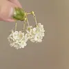 Pendientes geométricos de perlas y circonitas transfronterizos europeos y americanos, pendientes exquisitos de nicho de lujo ligero de alta gama, accesorios para orejas simples y elegantes para mujer