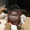 Bolso de Mano de Comercio Exterior Bolso Cubo para Mujer Moda Nueva Otoño e Invierno Bolso de Hombro para Viajes de Negocios Bolso Cruzado Retro de Alta Gama