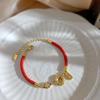 Pulsera de Acero Titanio para Mujer con Cuerda Roja de la Suerte, Moneda Dorada, Pulsera Festiva Sencilla, Nuevo Ingreso de Cobre Transfronterizo de Lujo