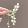 Pinza grande de lujo estilo vintage de Lirio del Valle con borlas para mujer, elegante pinza de tiburón accesorio para el cabello