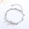 Pulsera temperamento cabello generación de fábrica damas pulsera de cristal en forma de corazón hueco pulsera coreana flor de coche diamante trébol de cuatro hojas