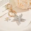 Colgante llavero de estrella de mar, un accesorio creativo y único para bolsos y otros artículos, un producto popular transfronterizo con un diseño realista de estrella de mar